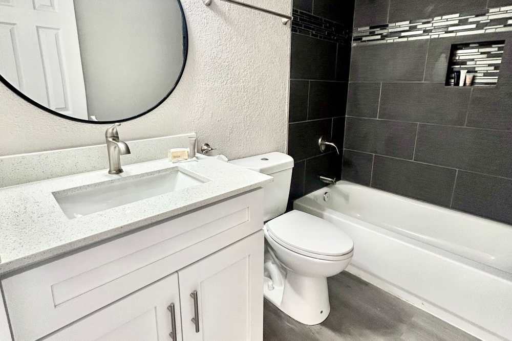 Bright bathroom at Athena Garden Apartments in Athens, Texas