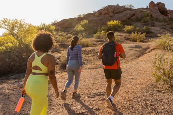 Friends going for a hike in the desert at Canopy at Cottonwood in Casa Grande, Arizona