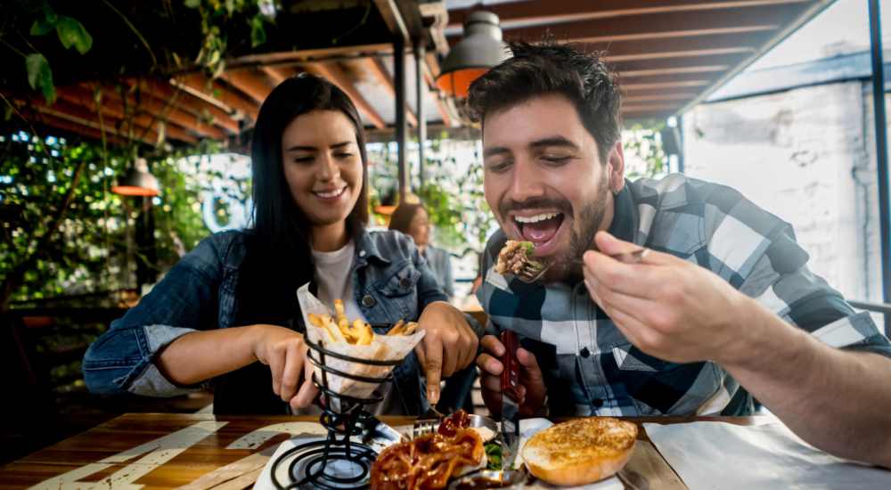 Residents having delicious food at a restaurant near Cross Timbers At Grand Street in Amarillo, Texas