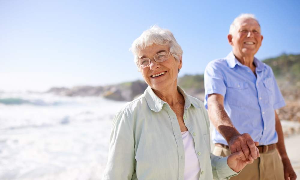 Residents walking the beach at Clearwater at The Arboretum in Austin, Texas