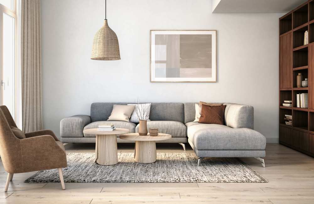 Living room with sofa, chair, coffee table and bookshelf at Comanche Hills in La Mesa, California