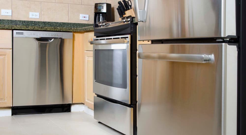 Modern kitchen with stainless-steel appliances at Eleven600 in Dallas, Texas