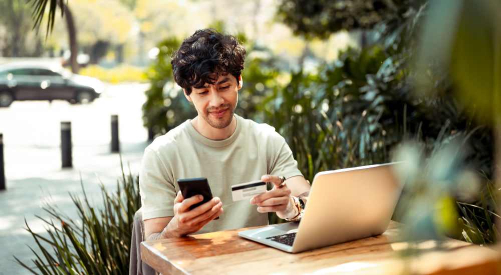 Resident doing online rental payment at Cedar Hill in Hilton, New York
