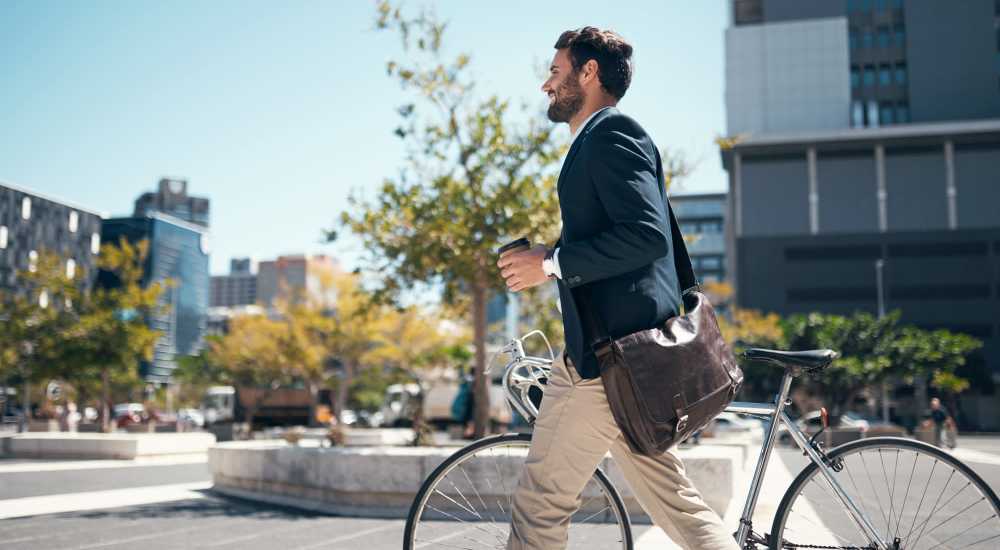 Resident with bicycle at Los Flamboyanes in Rochester, New York