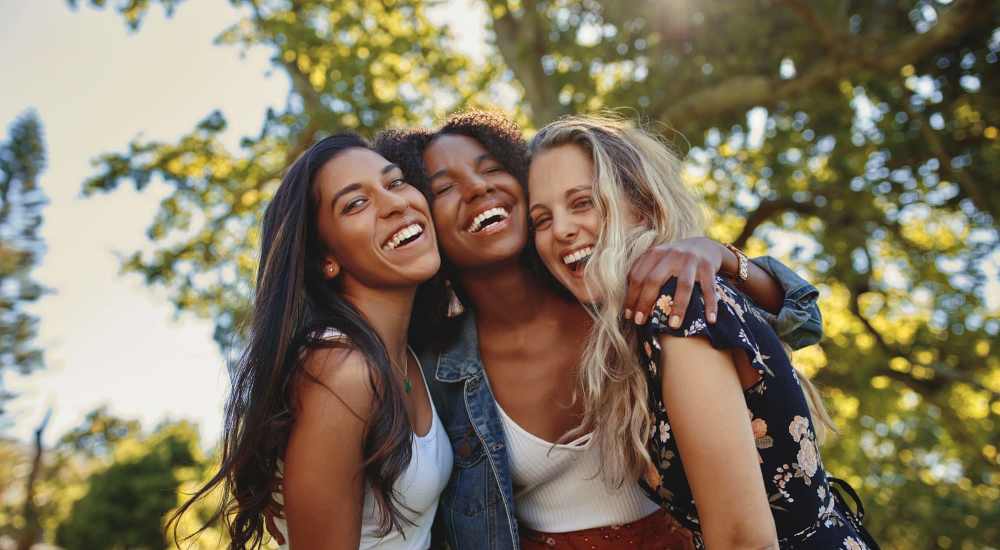 Happy faces of three friends at Woodlawn Lofts in Pittsburgh, Pennsylvania