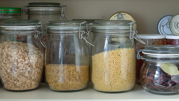 Organized glass jars in a pantry 