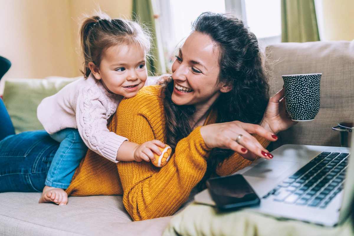 A resident enjoys some play time with her daughter in living room at Sugar Flats, Salt Lake City, Utah