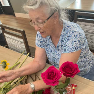 Resident creating a flower arrangement at The Clinton Presbyterian Community in Clinton, South Carolina