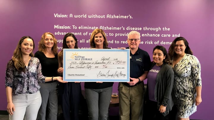 Golden Triangle Self Storage presenting check to The Alzheimer’s Association