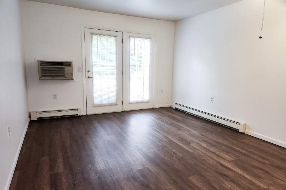 Apartment living room at Woodbrook Apartments in Three Rivers, Michigan