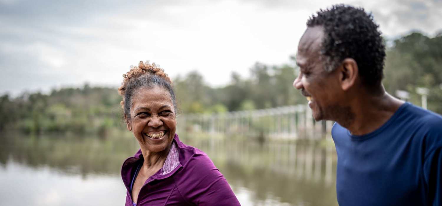 Smiling residents out on a walk near Grande Oak Apartments in Williamsburg, Virginia