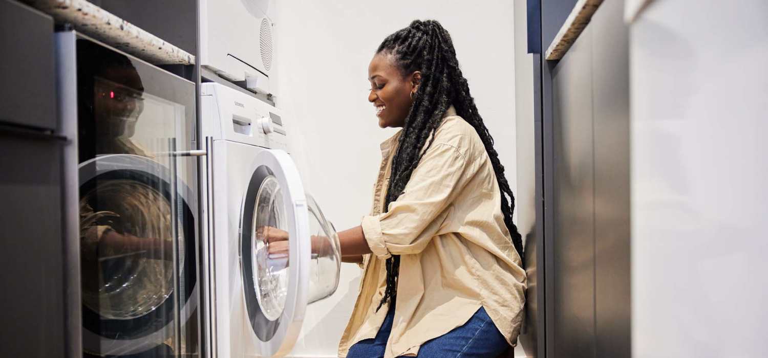 Resident using laundry at Carolina Avenue in New Bern, North Carolina