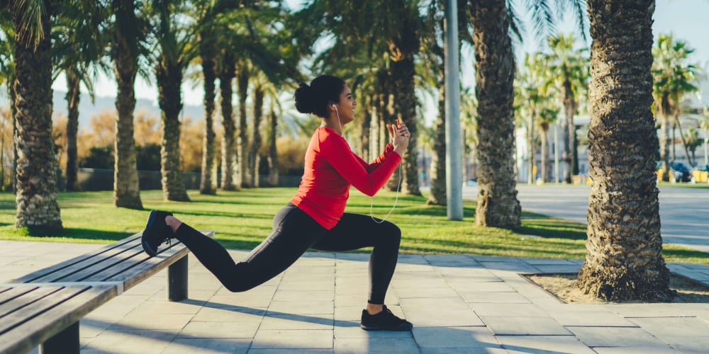 Resident stretching on a run outside near Tides at North Nellis in Las Vegas, Nevada