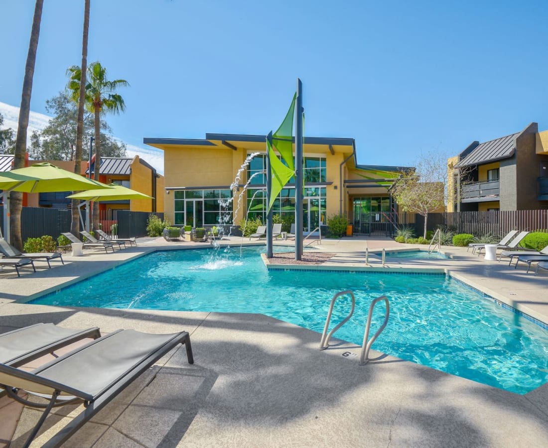 Resort-style pool and lounge chairs at Onnix in Tempe, Arizona