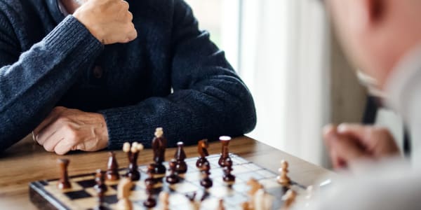 Resident playing chess at Retirement Ranch in Clovis, New Mexico