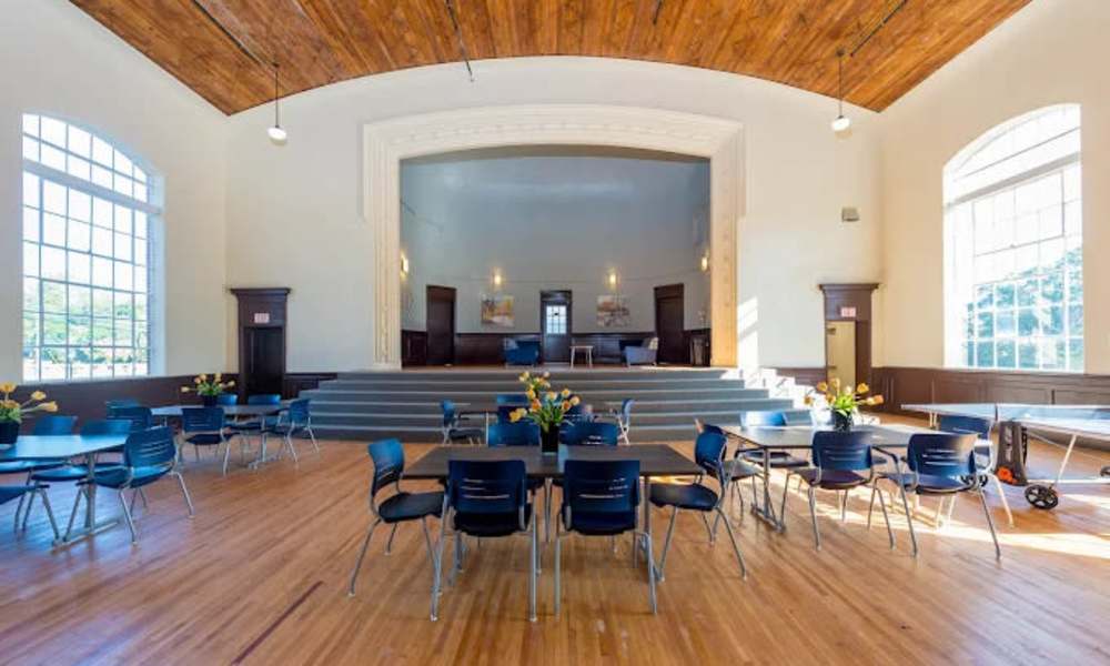 Community gathering space with wooden floors at A.L. Miller Village in Macon, Georgia