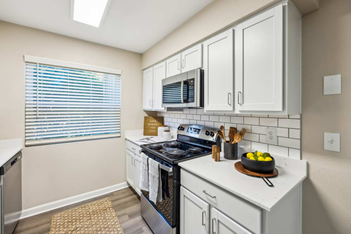 Updated kitchen with stainless steel appliances at Aspen Lodge in Overland Park, Kansas