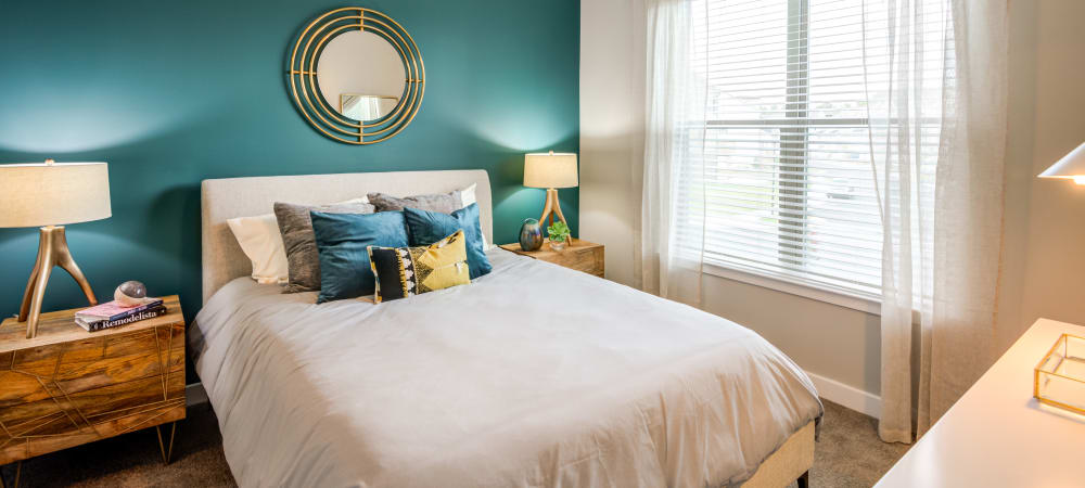 Nice well lit bedroom in a decorate model home at Flats At 540 in Apex, North Carolina