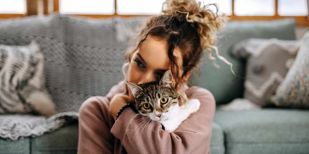 Young resident with her cat at Desert Meadows in Lancaster, California