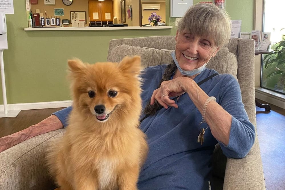 Resident with her dog at Lodi Commons Senior Living in Lodi, California