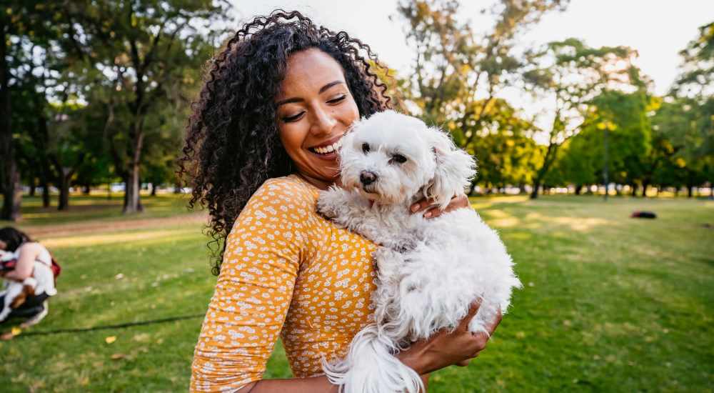Woman hugging her dog at The Summit in Redmond, Washington