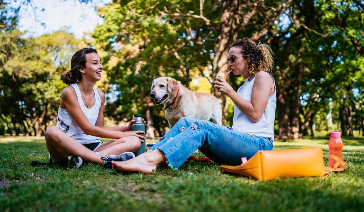 Resident friends in a park at The Tuscany On Pleasant View in Madison, Wisconsin