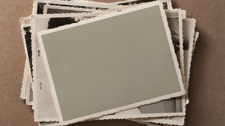 stack of old photographs | ways to show off personal cards and notes