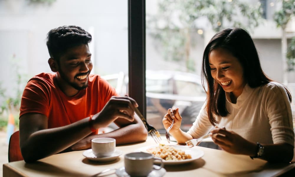 A couple eating at a restaurant near 1700 Exchange in Norcross, Georgia