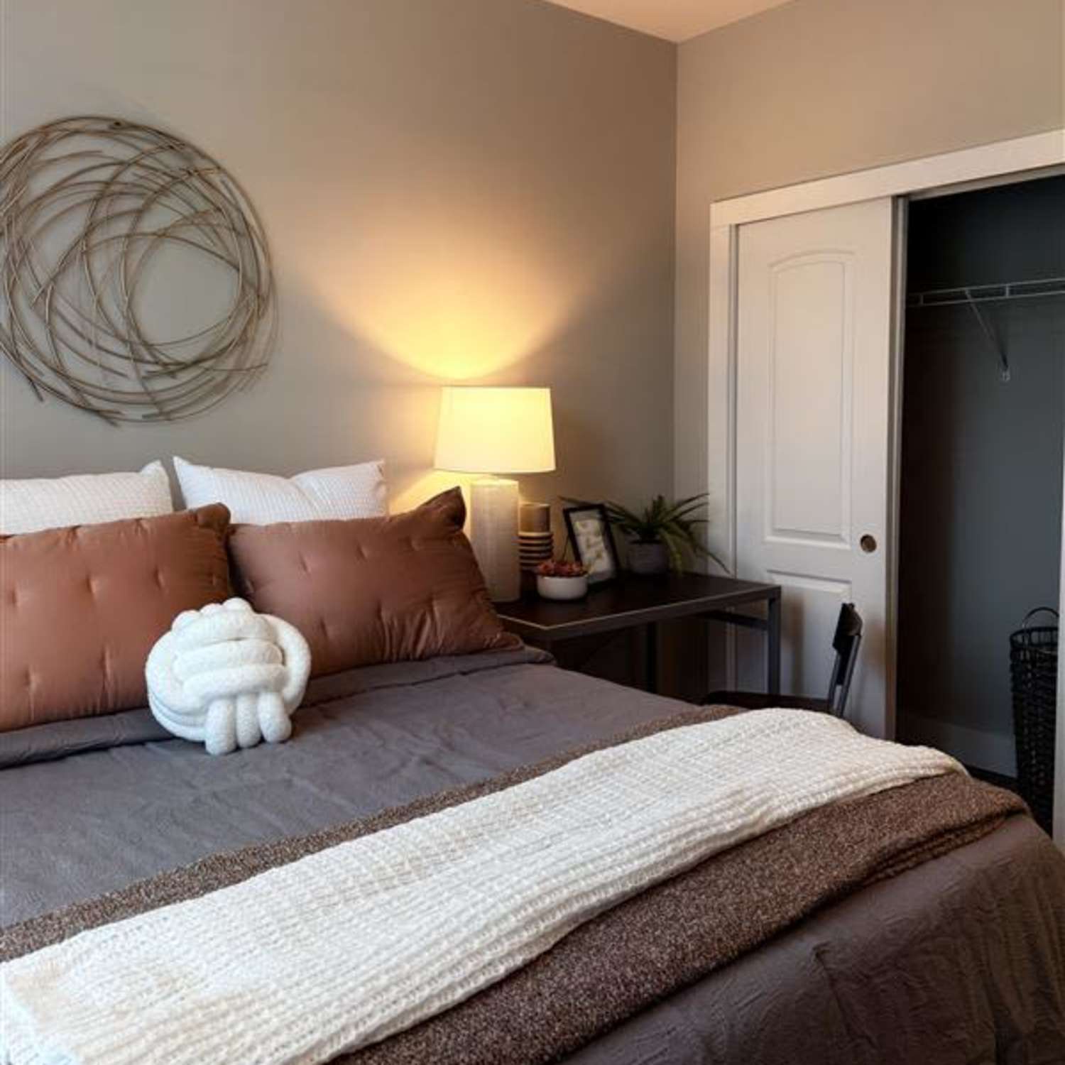 Bedroom with hardwood floors at The Quarters Bloomington in Bloomington, Indiana