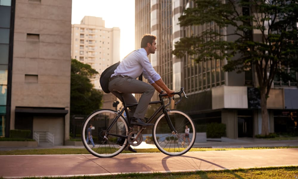 Resident biking to work at his downtown office near Oaks Hackberry Creek in Las Colinas, Texas