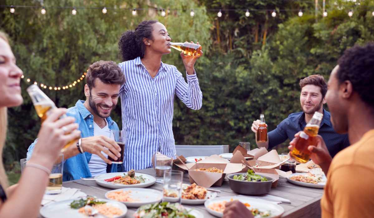 Residents chilling together with food and drinks at Penthouses at Capitol Park in Sacramento, California