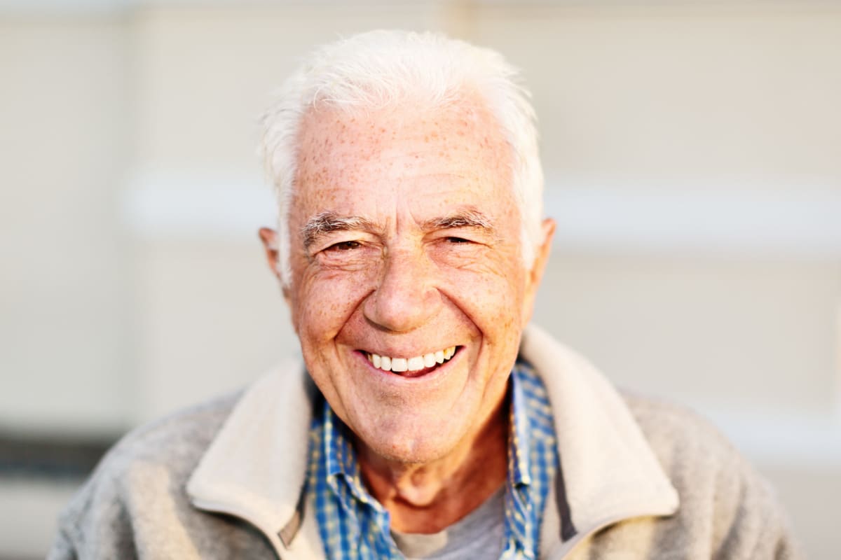 Resident smiling into the camera at Oak Pointe of Warrenton in Warrenton, Missouri