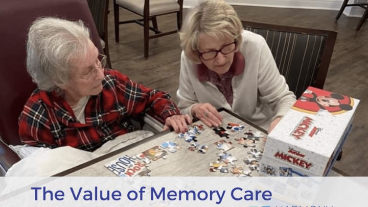 two women in harmony square building a puzzle