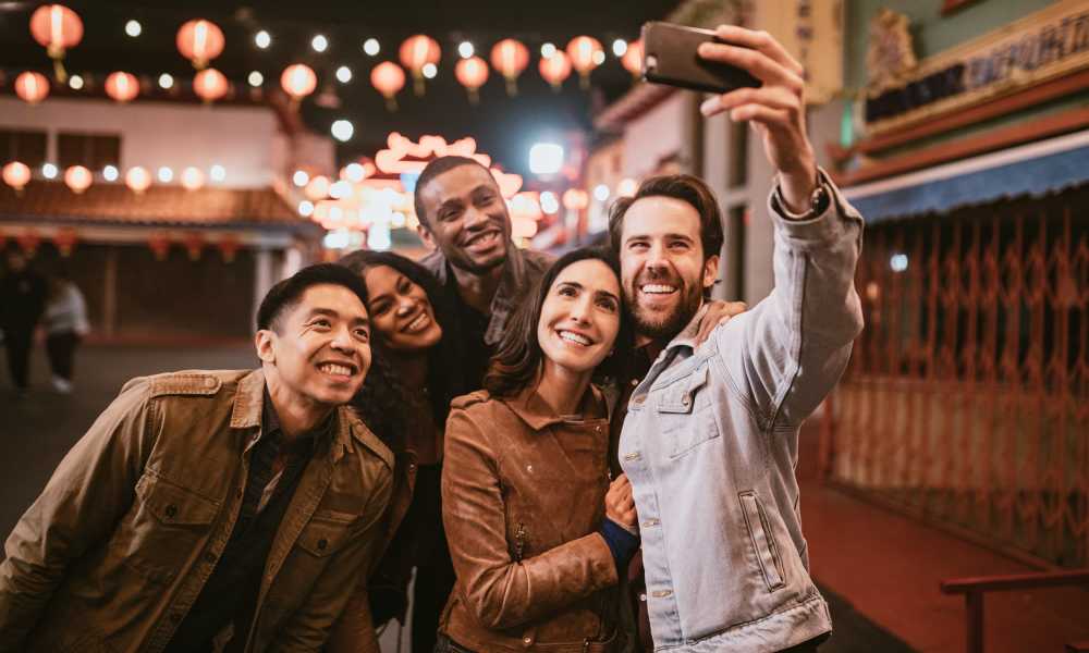 Residents with friends enjoying time in night at city street  Brookland Artspace Lofts in Washington, District of Columbia