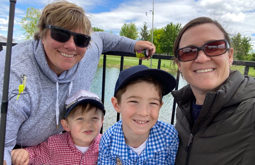 Jill from Touchmark at Meadow Lake Village in Meridian, Idaho and her family pose for a photo.