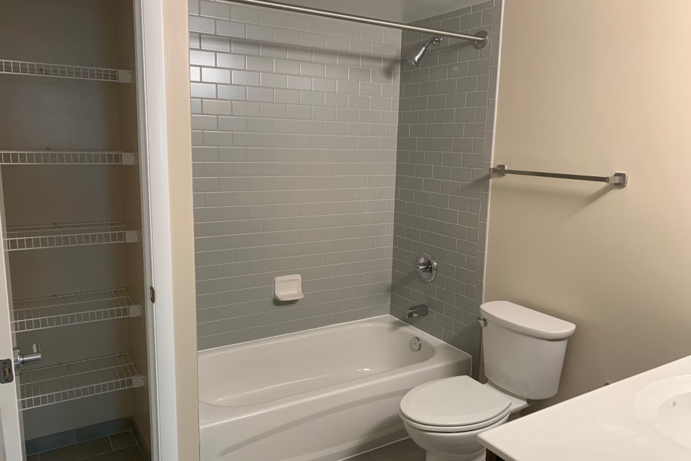 Master bathroom and linen closet at Randle Hill Apartments in Washington, District of Columbia