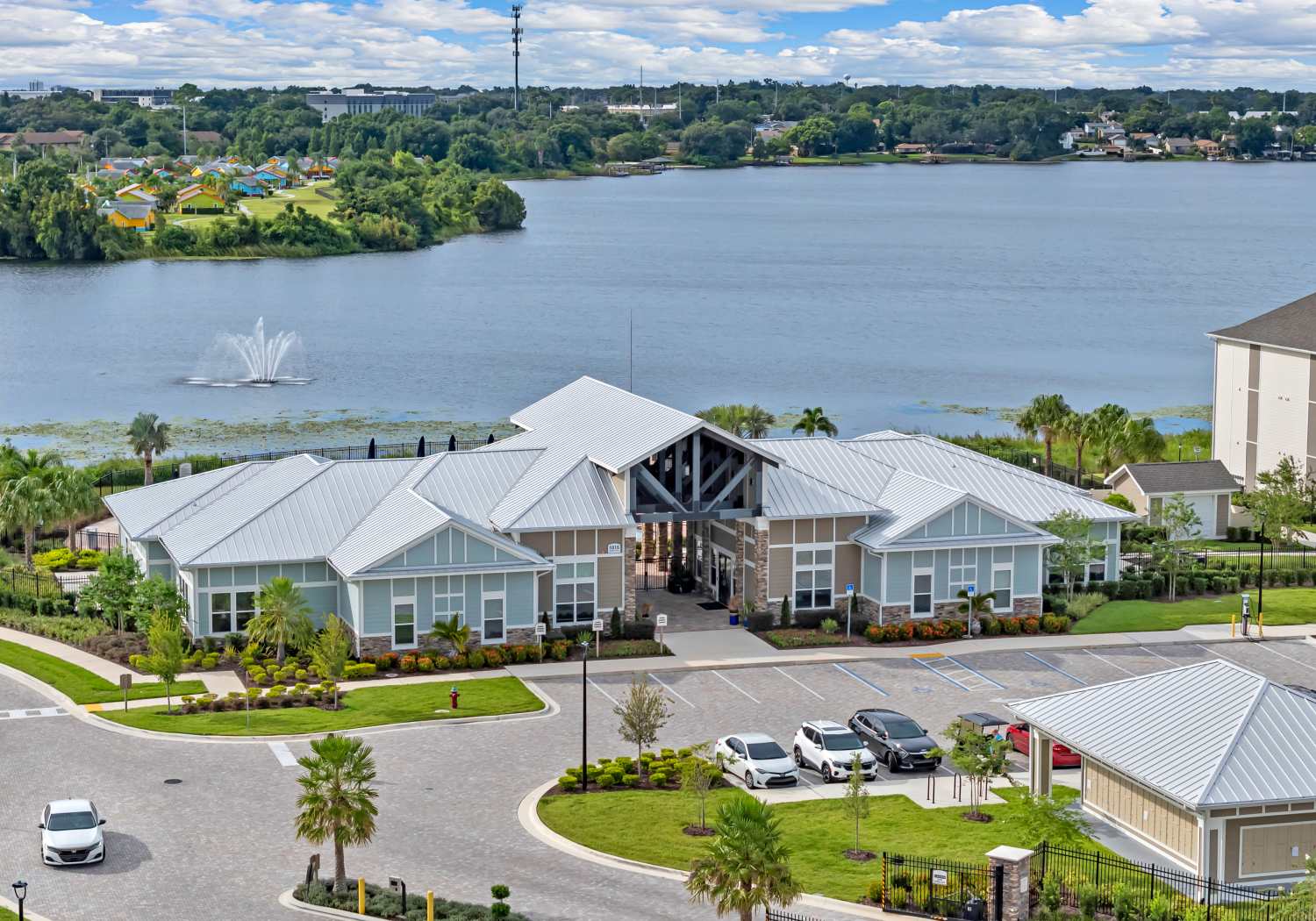 Clubhouse exterior with lakefront view at The Carlton At Lake Dexter in Winter Haven, Florida