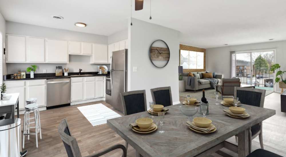 Black and white theme kitchen with wooden style flooring and stainless-steel sink at Midvale Heights in Chattanooga, Tennessee