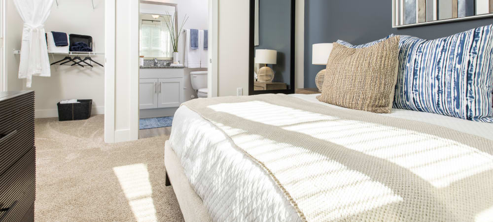 Nice well lit bedroom in a decorate model home at South City Apartments in Summerville, South Carolina