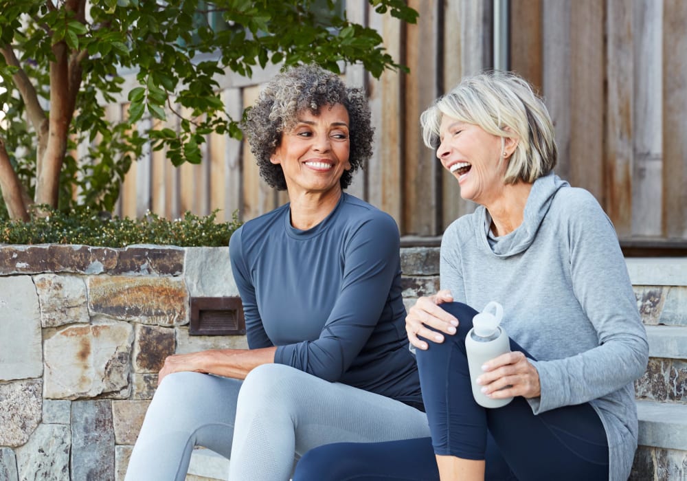 Resident friends chatting on the stoep outside at Terra Camarillo in Camarillo, California