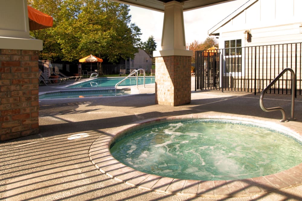 Resort-style swimming pool at Slate Ridge at Fisher's Landing Apartment Homes in Vancouver, Washington