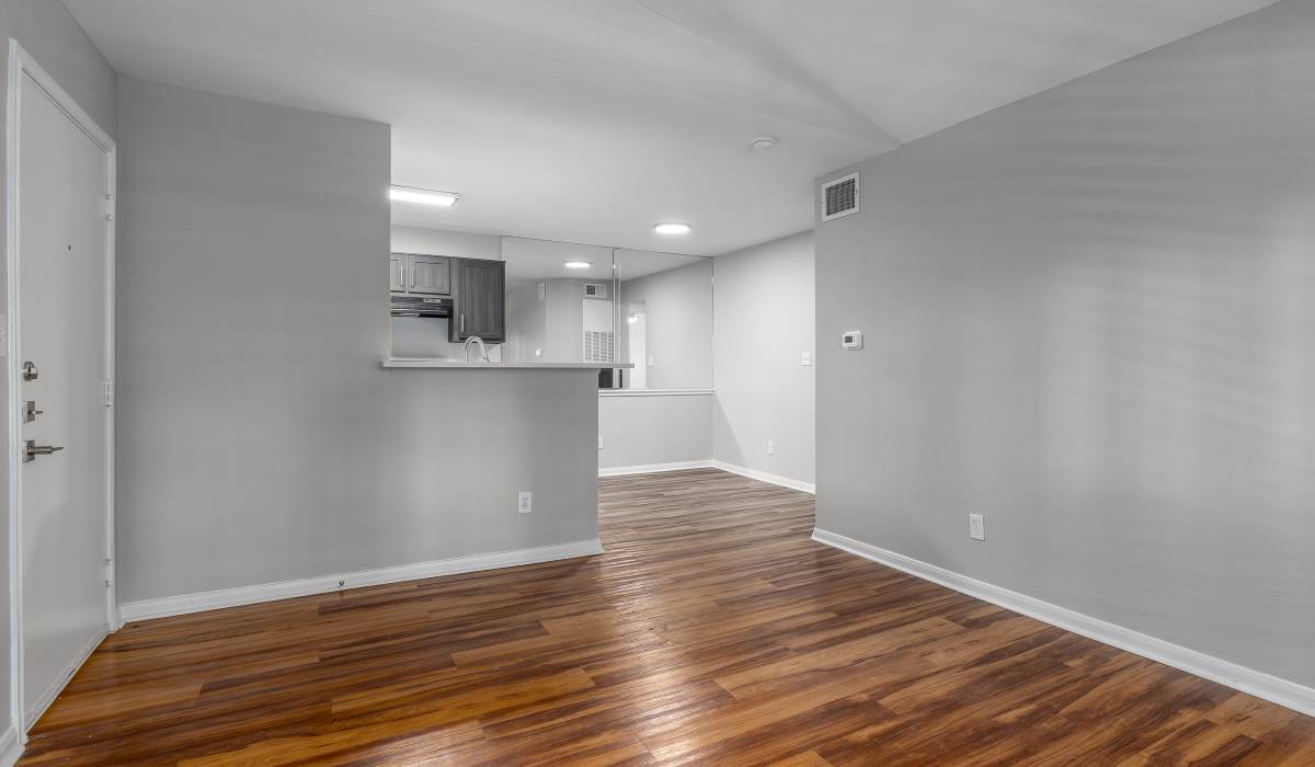Open living and dining area at Oaks of Kingwood Apartments in Kingwood, Texas