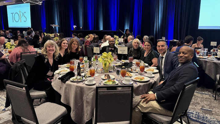 People posing at an event