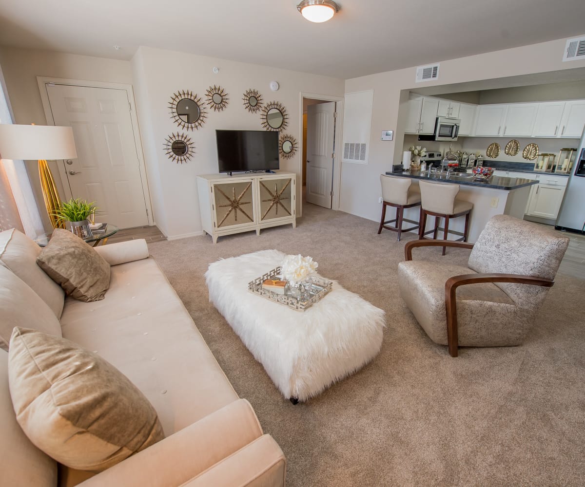 Well-lit living room at Watercress Apartments in Maize, Kansas