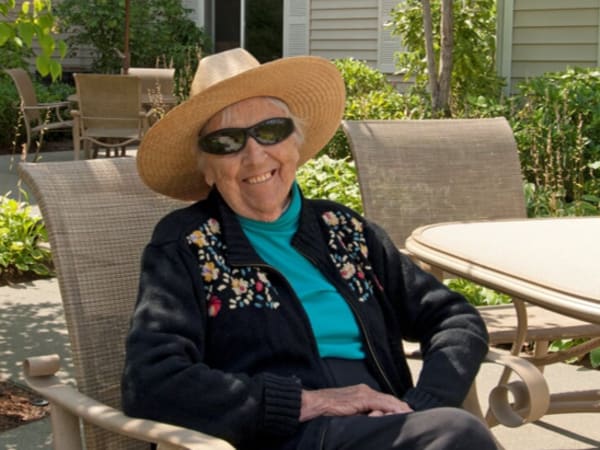 A resident enjoying a nice day outside at Patriots Glen in Bellevue, Washington. 