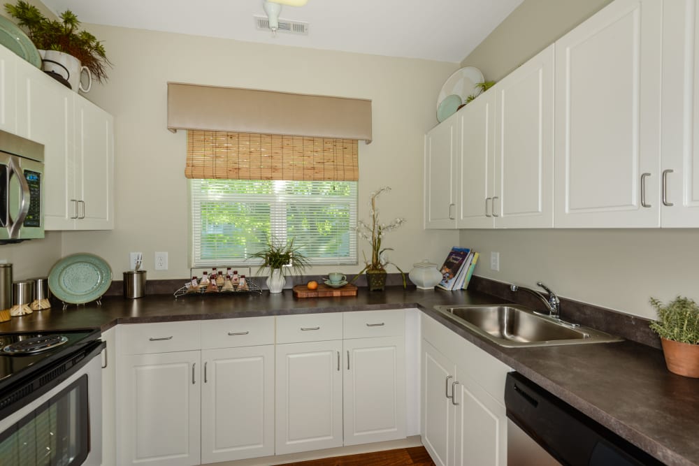 Kitchen with white cabinets at Sofi Danvers in Danvers, MA