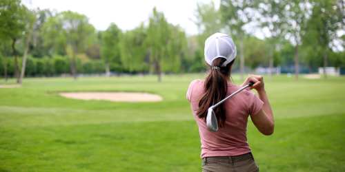 Resident playing golf on a golf court near Lexington Green in El Cajon, California