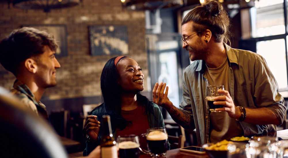 Residents having delicious food at a restaurant near Stadium West Apartments in Arlington, Texas