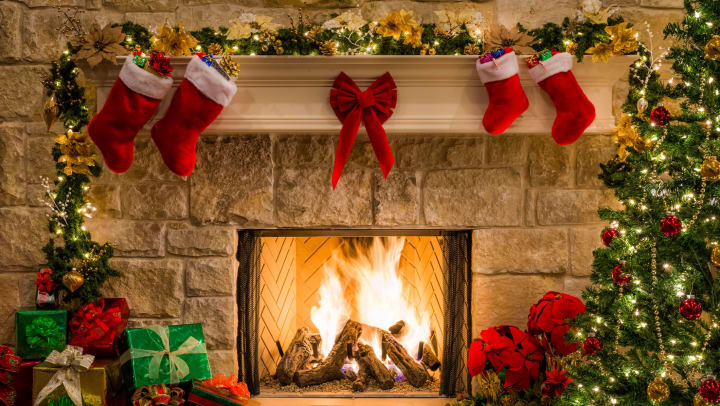 Beautiful Christmas decorations surrounding a fireplace