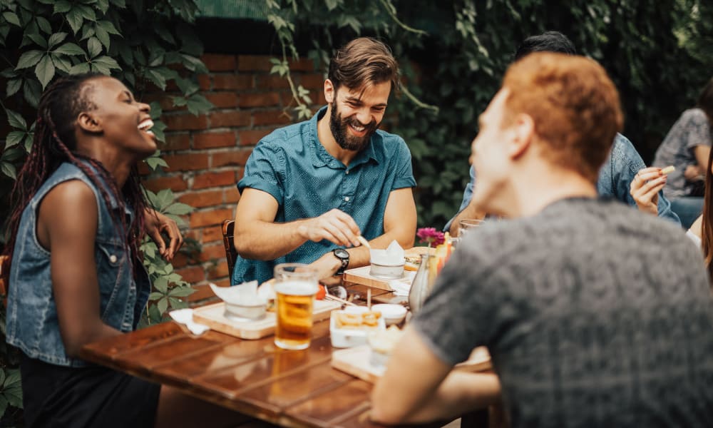 Friends dining outside at Castleberry Property Management Group inc. in Birmingham, Alabama